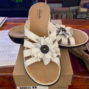 Clark’s white floral leather sandals.